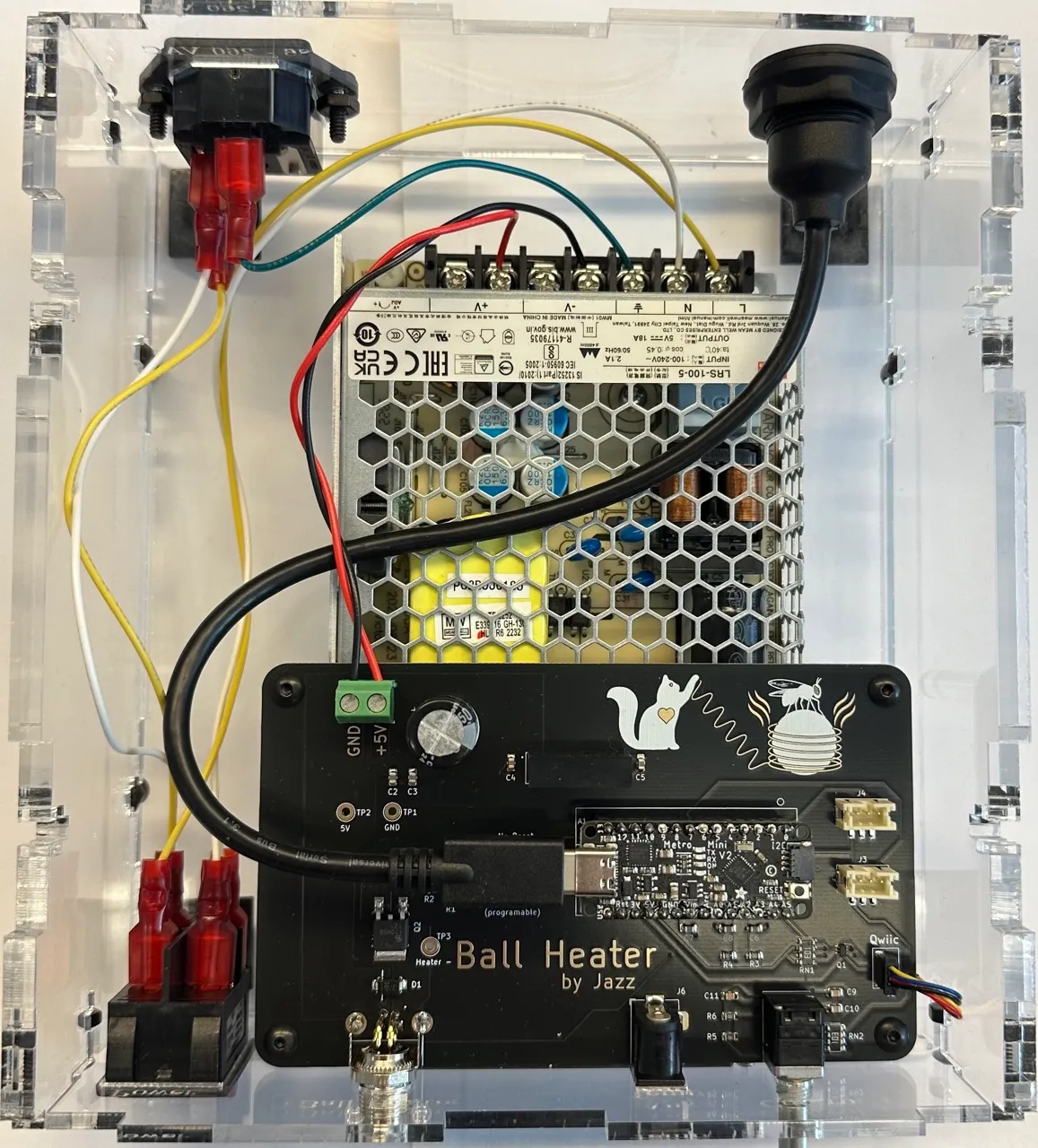 Ball heater controller board inside its clear enclosure